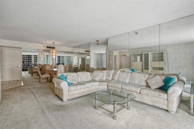 carpeted living room featuring a textured ceiling