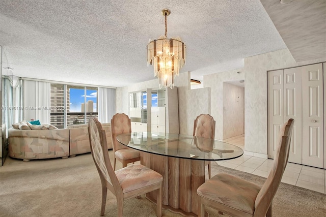 dining area with light tile patterned floors, a textured ceiling, light carpet, and an inviting chandelier