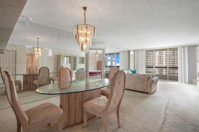 dining room featuring light colored carpet, a textured ceiling, and a chandelier