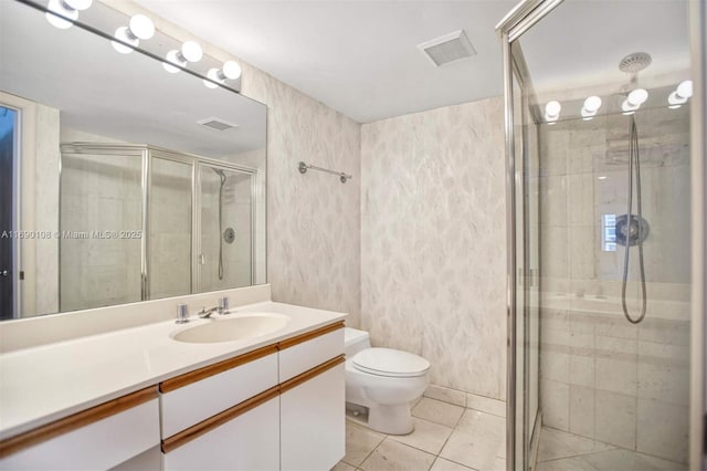 3530 Mystic Pointe Dr Unit 914, Aventura, FL 33180 - bathroom featuring a shower stall, toilet, vanity, and tile patterned floors