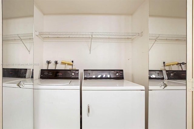 laundry room with washing machine and clothes dryer