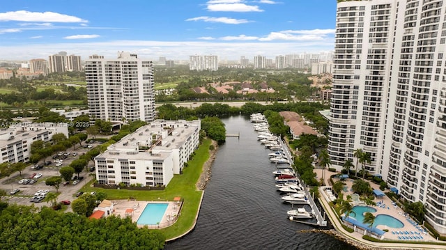 birds eye view of property with a city view and a water view