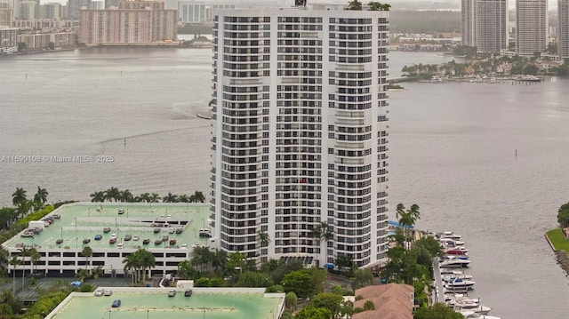 view of building exterior featuring a view of city and a water view