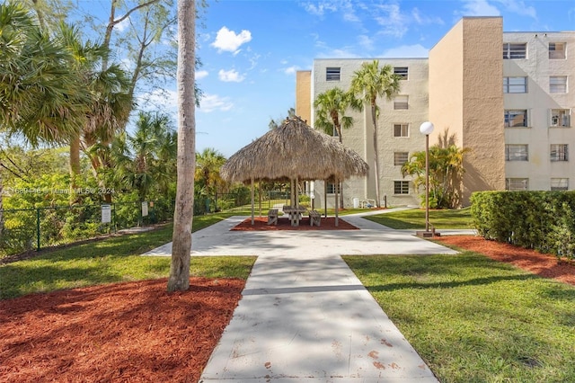 surrounding community featuring a gazebo and a lawn