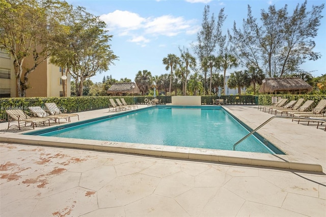 view of swimming pool with a patio