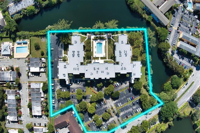 birds eye view of property featuring a water view