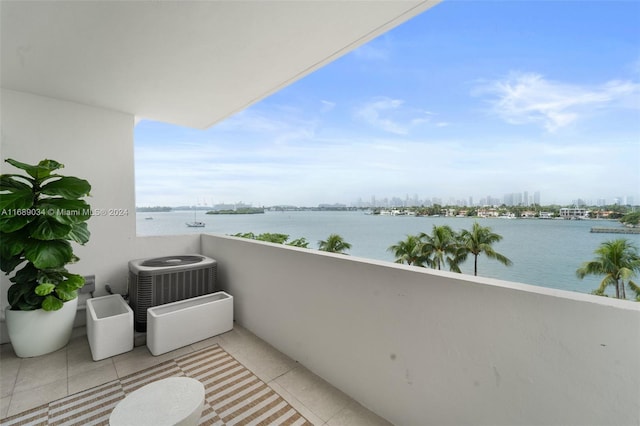 balcony with cooling unit and a water view