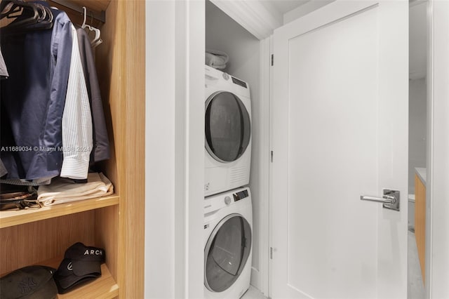 laundry room featuring stacked washer and dryer