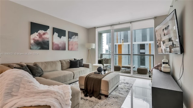 living room featuring a wall of windows