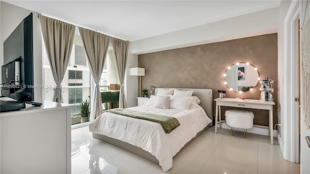 bedroom with light tile patterned floors