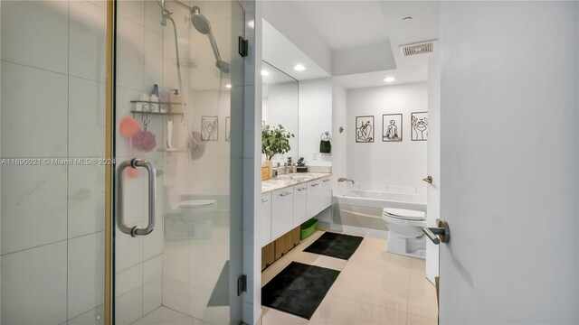 full bathroom featuring vanity, separate shower and tub, and toilet