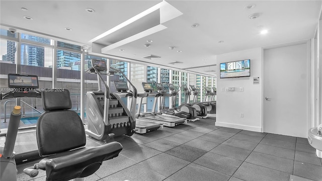 workout area with plenty of natural light and floor to ceiling windows