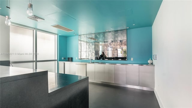 interior space featuring dishwasher, pendant lighting, and backsplash