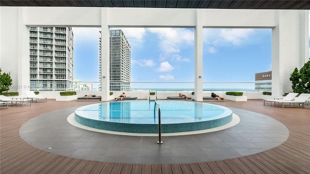 view of pool featuring a water view