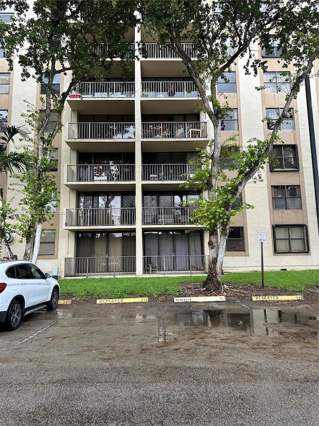 view of property featuring uncovered parking