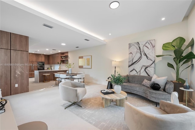 living room with visible vents and recessed lighting