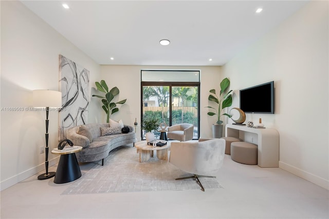 living room with recessed lighting and baseboards