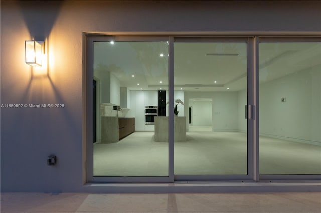 entrance to property featuring a patio