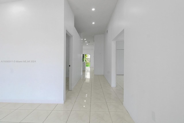 corridor featuring light tile patterned floors