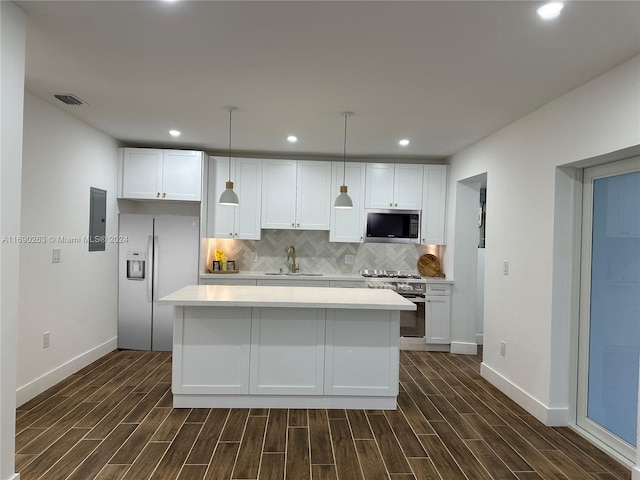 kitchen featuring dark wood-type flooring, sink, white cabinets, and stainless steel appliances