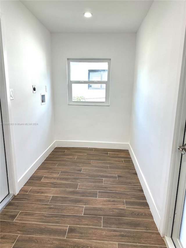 unfurnished room featuring dark hardwood / wood-style floors