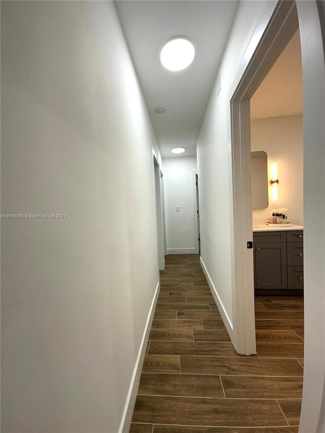 hallway featuring dark wood-type flooring