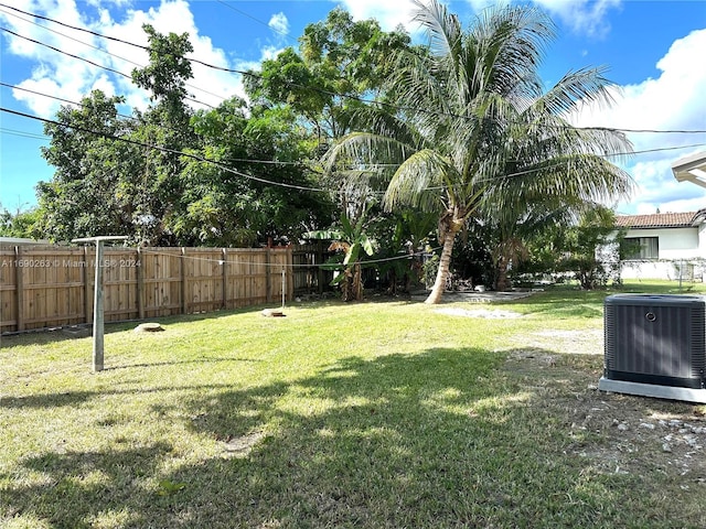 view of yard featuring central air condition unit