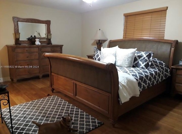 bedroom featuring hardwood / wood-style floors