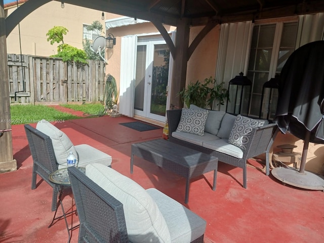 view of patio / terrace with outdoor lounge area, french doors, and a gazebo