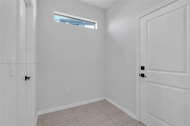 interior space with light tile patterned floors