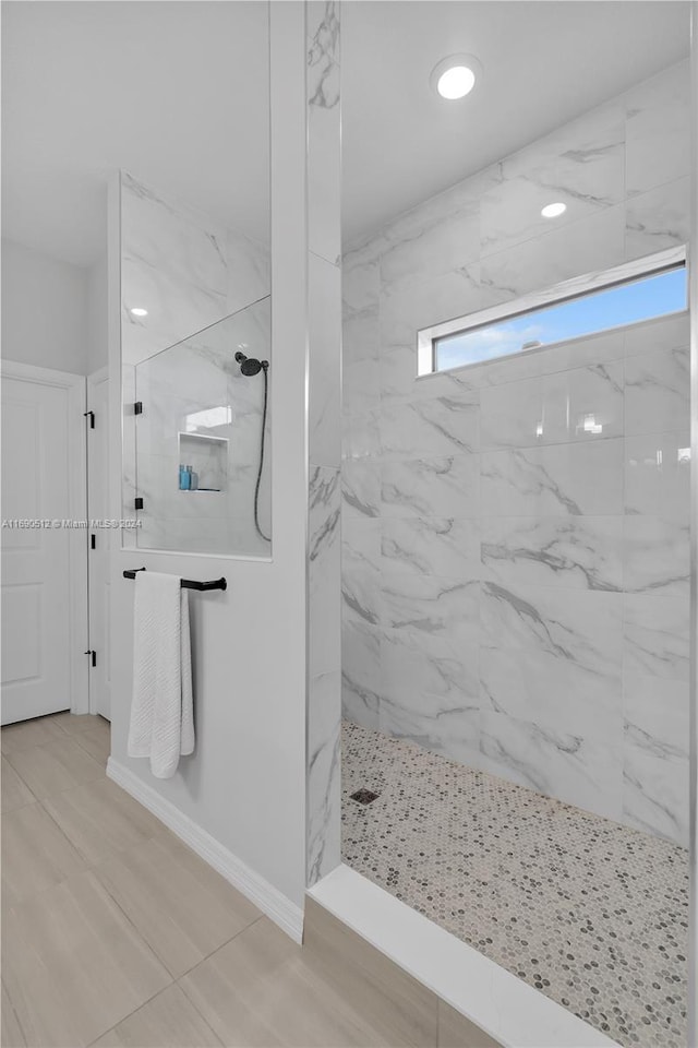 bathroom featuring tiled shower