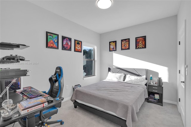 bedroom featuring light colored carpet