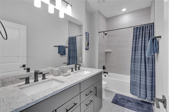 full bathroom featuring shower / bath combo, vanity, toilet, and tile patterned floors