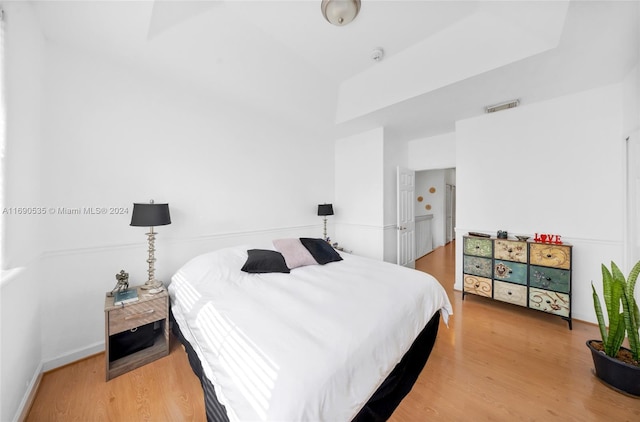 bedroom with wood-type flooring