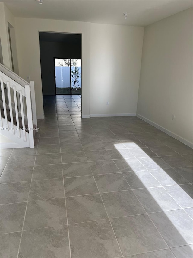 unfurnished room with light tile patterned floors