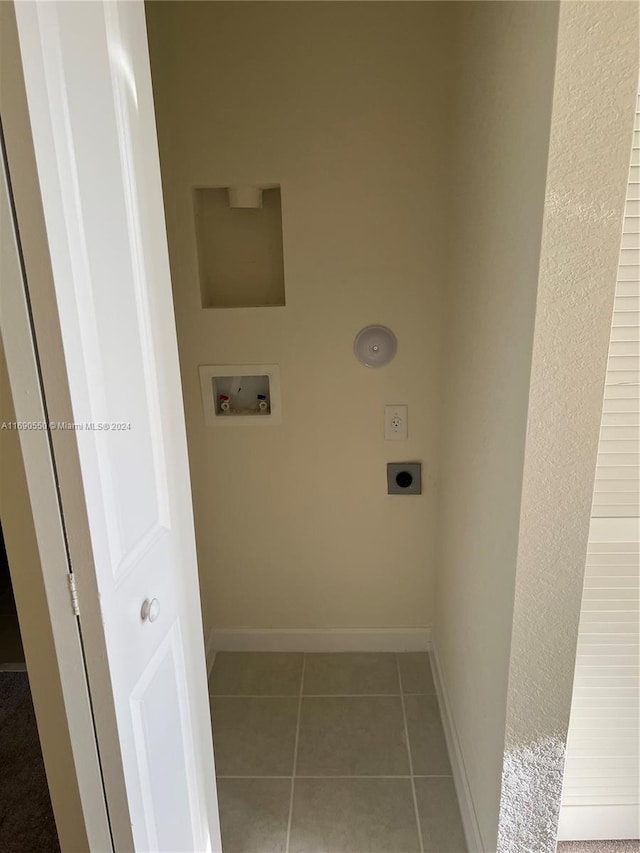 washroom with hookup for a washing machine, tile patterned floors, and electric dryer hookup