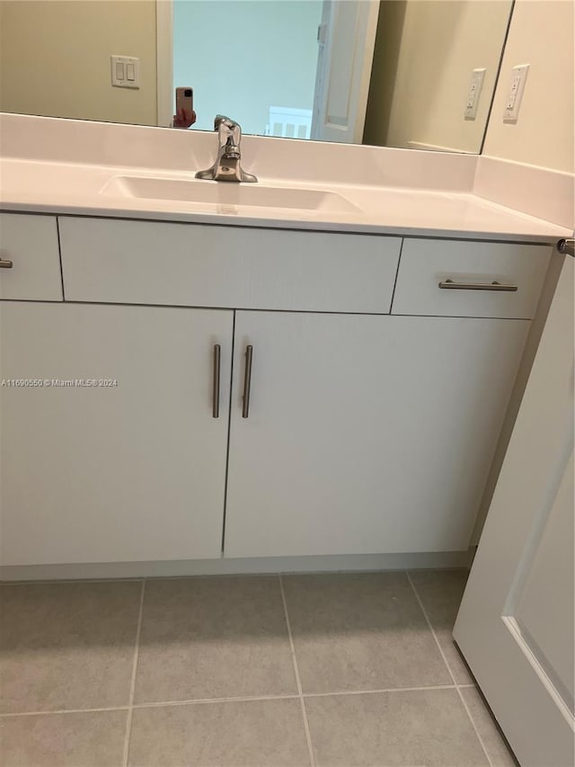 bathroom featuring vanity and tile patterned flooring