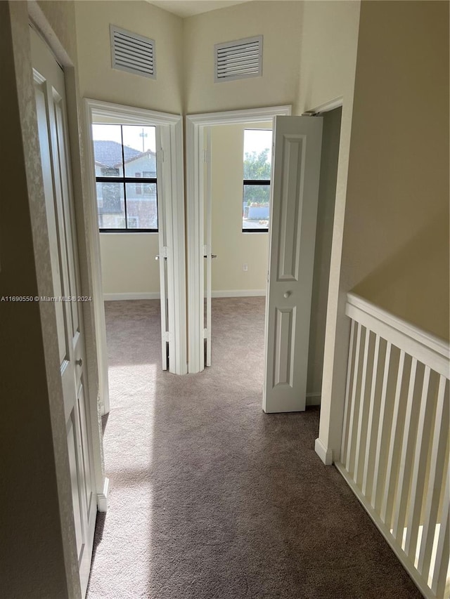 corridor featuring carpet flooring