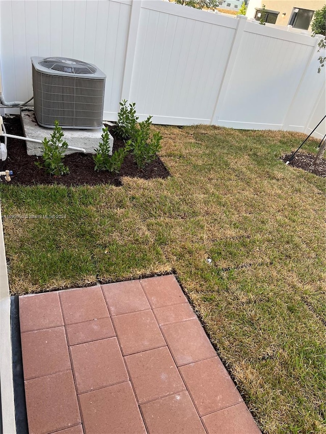 view of yard with central AC unit