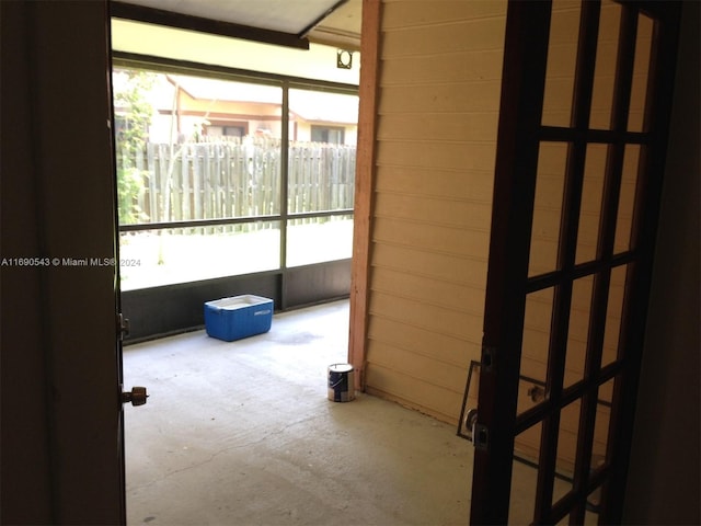 hallway with concrete flooring