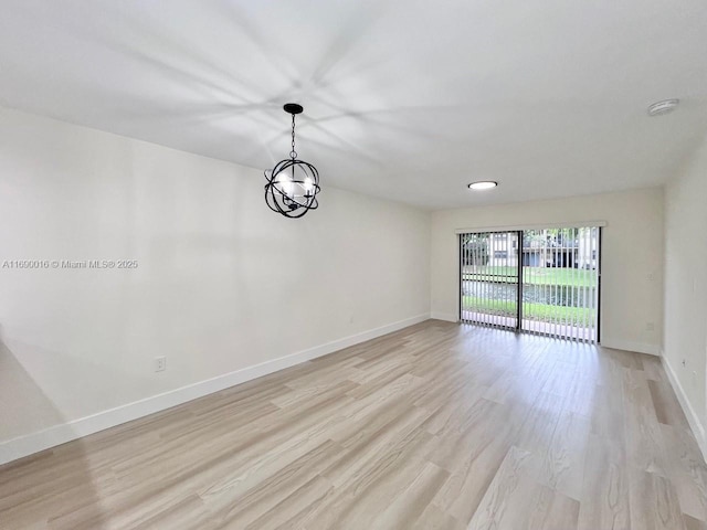 unfurnished room with light wood-type flooring