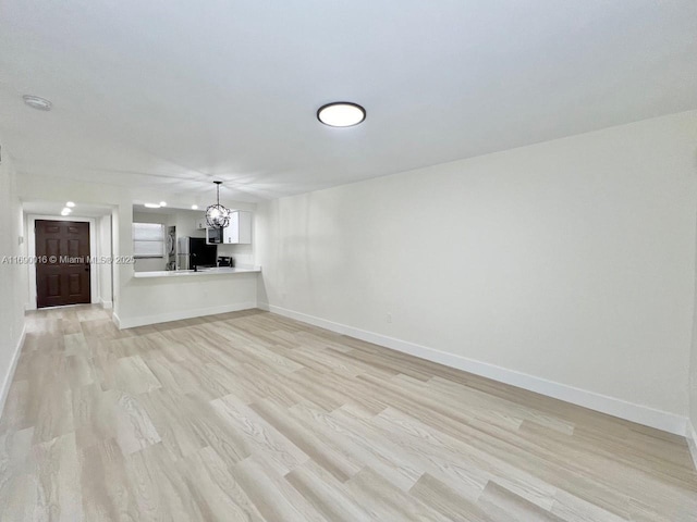 unfurnished living room featuring light hardwood / wood-style flooring