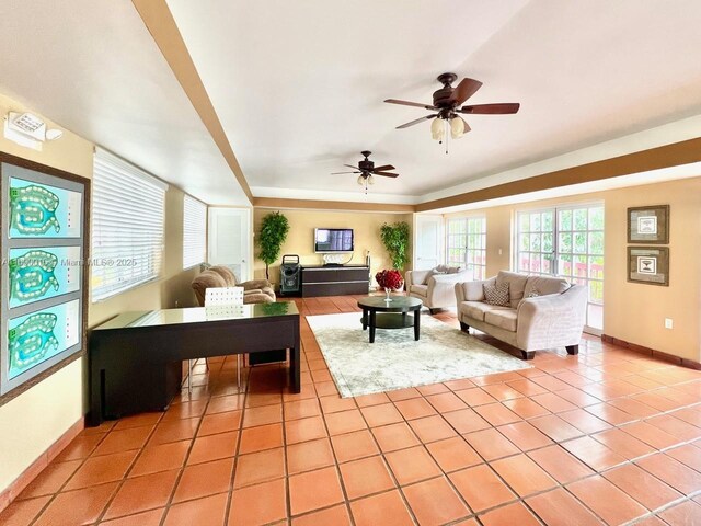 tiled living room featuring ceiling fan