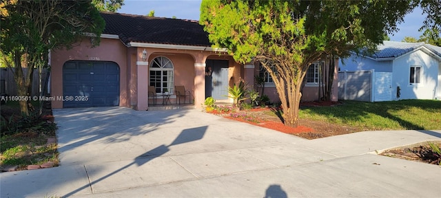 view of front facade with a garage and a front yard