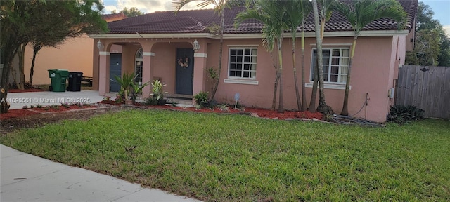 mediterranean / spanish-style house featuring a yard