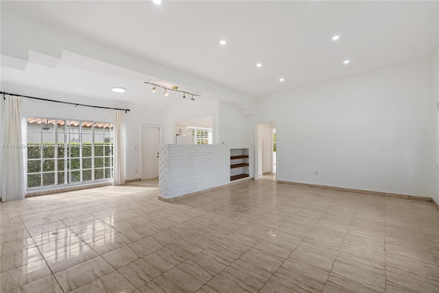 unfurnished living room with plenty of natural light