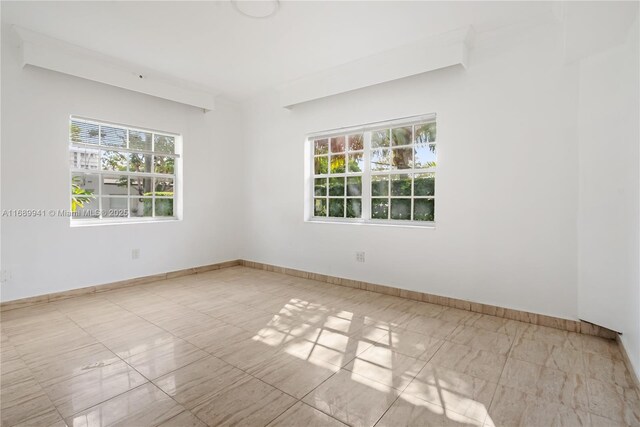 kitchen featuring sink, white cabinets, white appliances, and light tile patterned floors