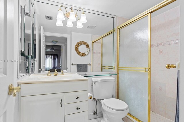 bathroom featuring walk in shower, vanity, and toilet