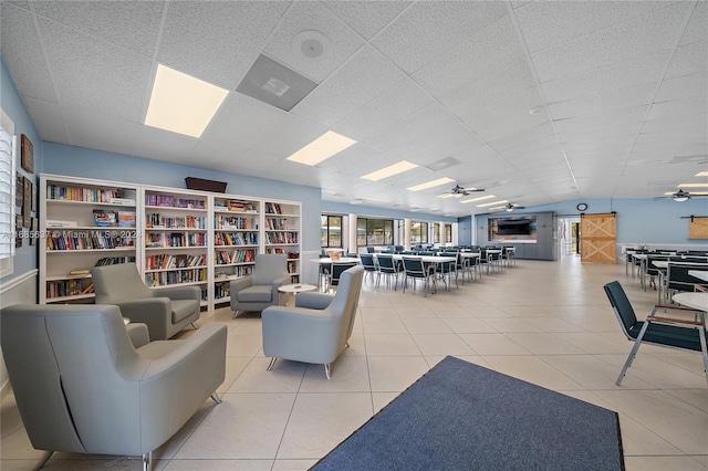 interior space with ceiling fan