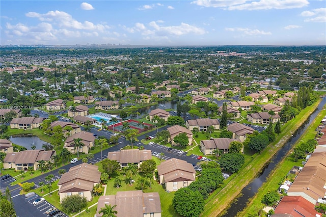 bird's eye view with a water view